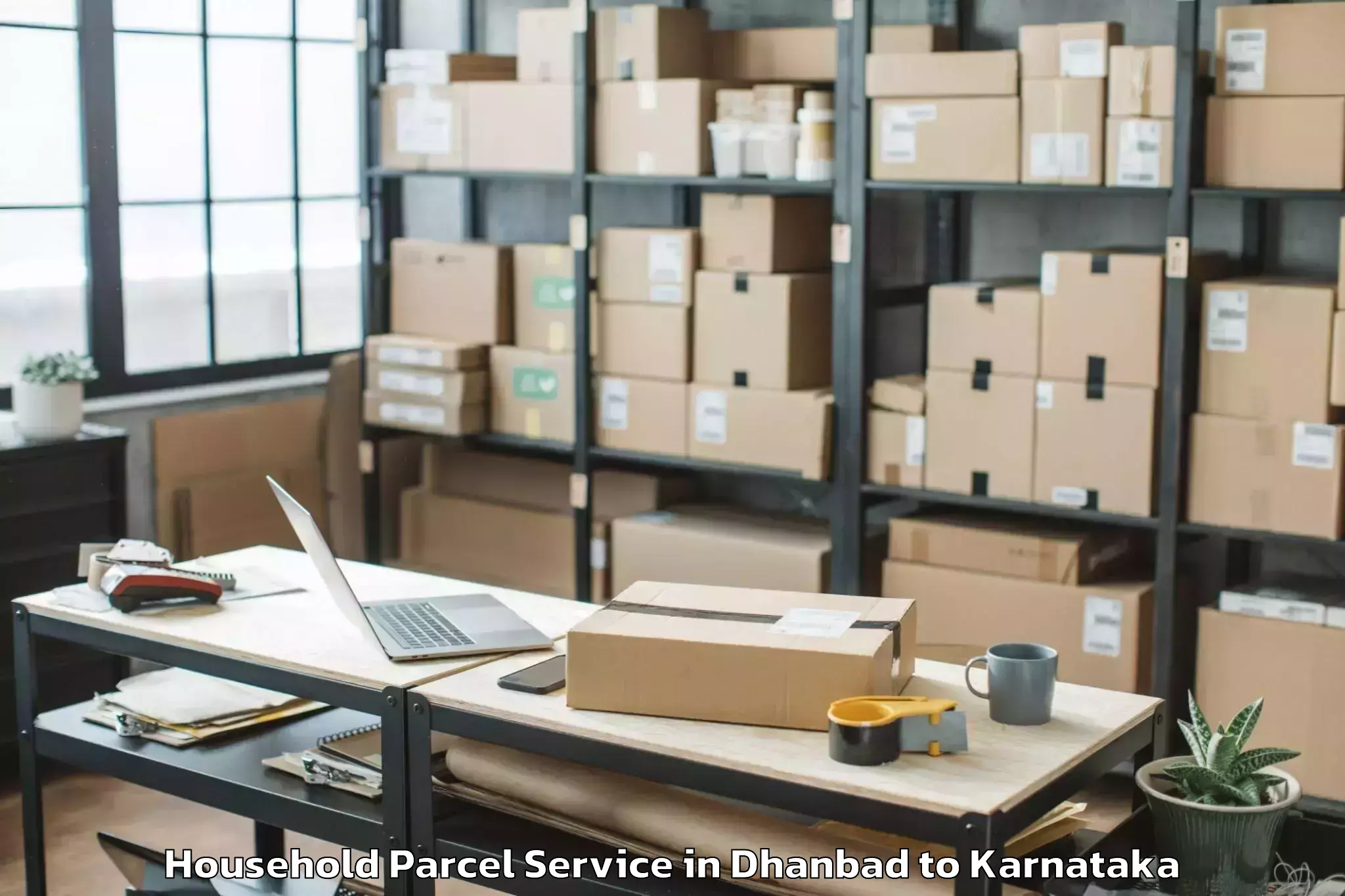 Easy Dhanbad to Karnataka Janapada Vishwavidya Household Parcel Booking